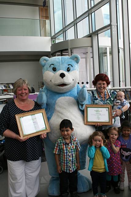 Maureen Watson, Irene Peachey (holding 9-week-old Jack Barker Gorse) and children from Number One Riverside’s library
