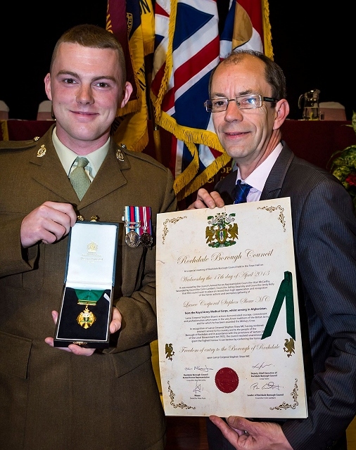 Lance Corporal Stephen Shaw with Council Leader Colin Lambert and the Freedom of the Borough scroll