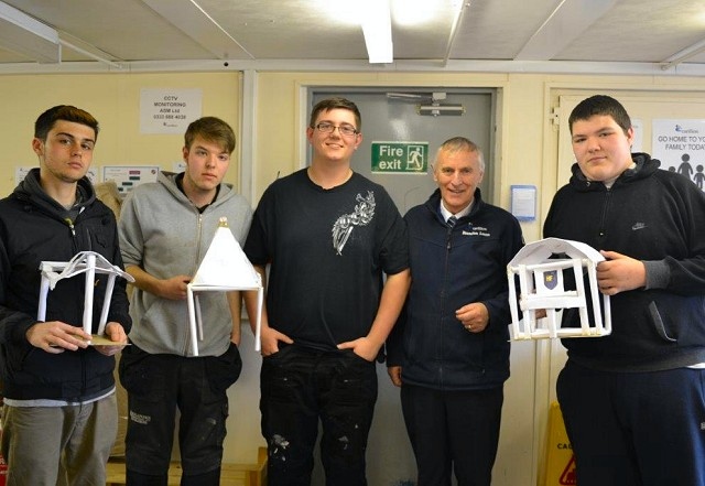 Leon McNeice, Aidan Suleman, Mark Ravenna, Brendan Lunn (Carillion Site Manager) and Josh Mulleeney with their model buildings