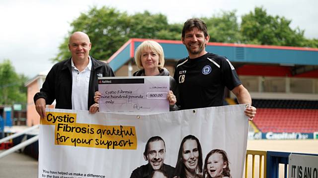 Dale Supporters Trust Chairman, David Gartside, who was joined by Rochdale AFC Assistant Manager Chris Beech, presented the CFT with a cheque 