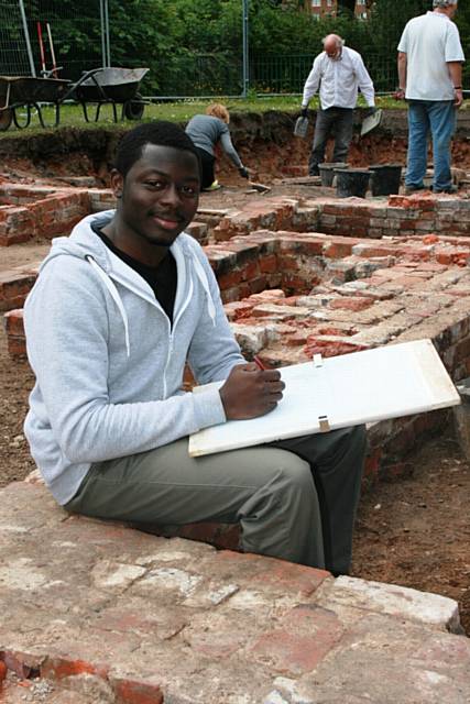 Jonah Yusuf at the foundations of Balderstone Hall lying hidden underneath Balderstone Park have been unearthed by professional and novice archaeologists