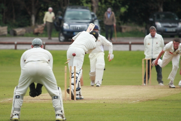 Riley Paterson bowls Denis Louis with a swinger