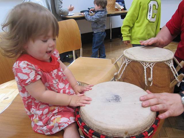 Little Jasmin Lloyd enjoys a trying out drumming 
