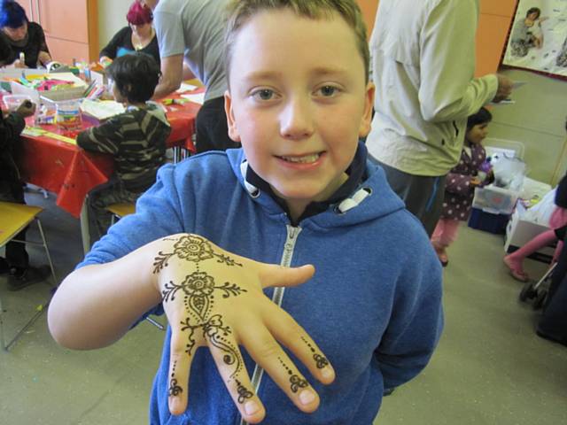 Ethan Harrison shows off his henna tattoo 
