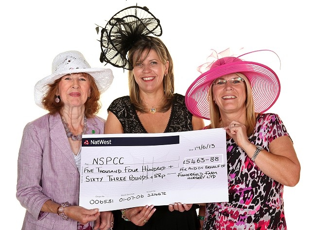 Cheque presentation at Ascot Ladies Day fundraiser for the NSPCC; Penelope Pace - Chairman of the Rochdale NSPCC Branch; Nicki McGill owner of Fisherfield Farm Nurseries; 
Liz Jackson from Fisherfields Farm Nurseries