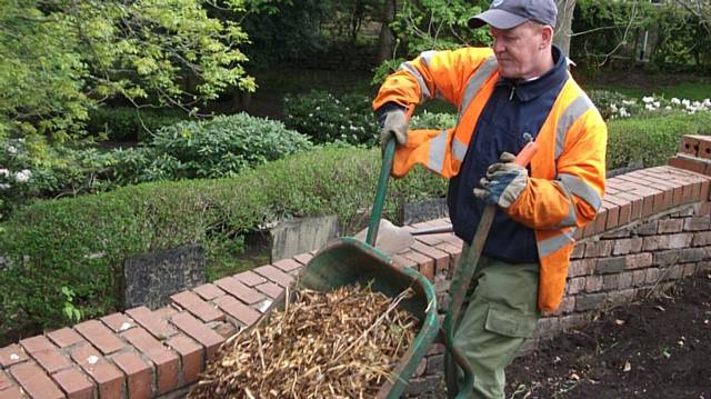 Volunteer Paul Rigby gets stuck in
at Middleton Cemetery, by St Leonard’s Church

