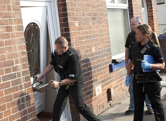 Police raiding house during Operation Resolute