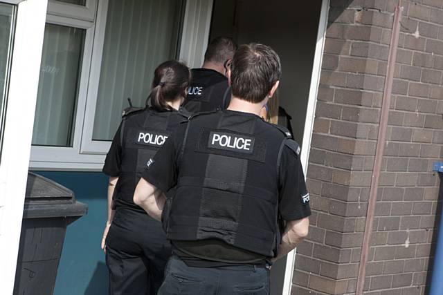 Police raiding house during Operation Resolute