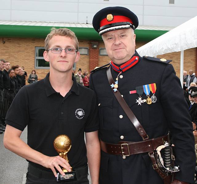 Stuart Snape, 18, from Rochdale, receiving his Best PE (level 1) award from the Deputy Lord-Lieutenant of Greater Manchester