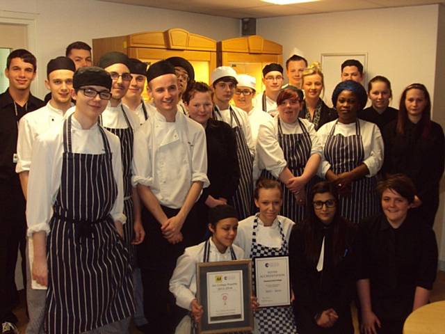 The hospitality and catering students proudly displaying their two recent accolades