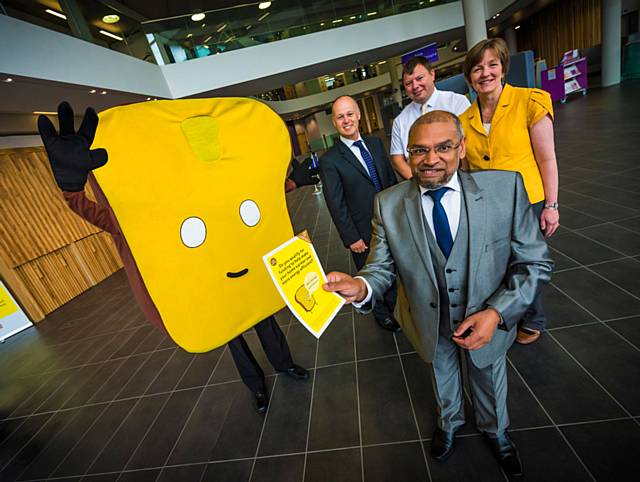 Foreground: Sultan Ali, cabinet member for strengthening communities and housing. L-R: Paul Matley, ScottishPower; Michael Morrall, Dyson Energy Services; Shona Thomas, Greater Manchester Energy Advice Service