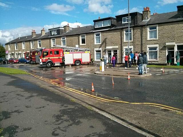 Entwistle Road is closed while crews work at the scene and people are advised to avoid the area