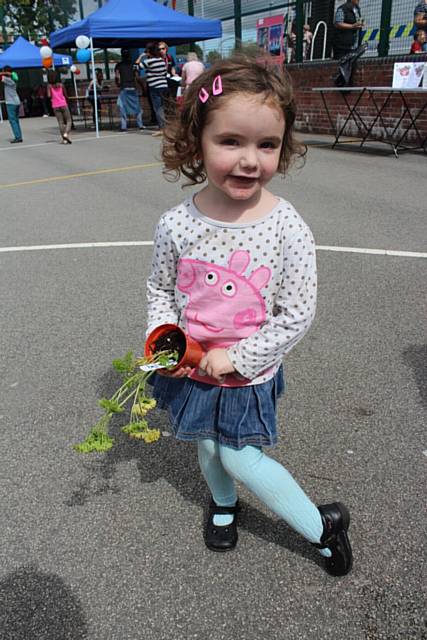 Emilia Deegan shows off the plant she planted herself!