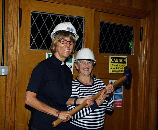 The Reverend Canon Sharon Jones (left) and Church Warden Susan Knight don their hard hats and get down to business