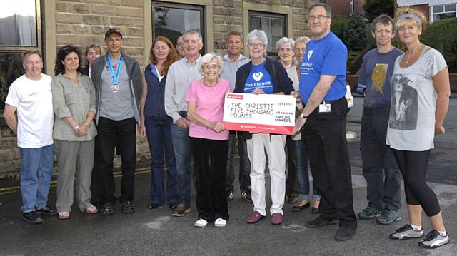 The cheque was presented to Angela and John Bannister from the Christie Hospital by Marjory Hawker-Bond, MBE with Andy O’Sullivan MBE and the Andems Runners