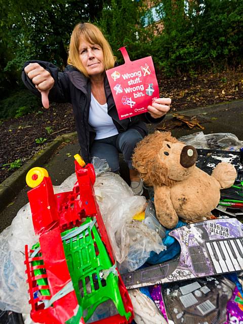 Councillor Jacqui Beswick, was tested to identify which household waste items were recyclable and belonged in either a green (blue lid), blue or brown bin