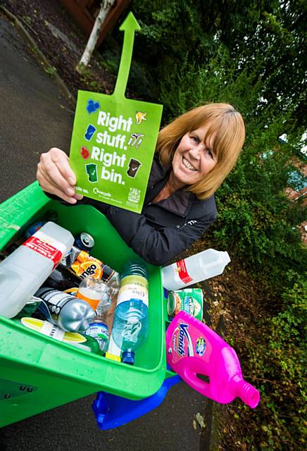 Councillor Jacqui Beswick, was tested to identify which household waste items were recyclable and belonged in either a green (blue lid), blue or brown bin