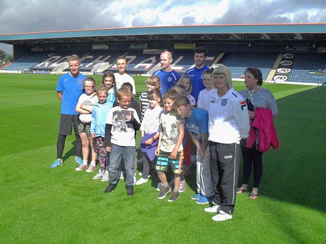 Captain Peter Cavanagh and defender Joe Rafferty meet some of the youngsters who took part in the Rochdale Borough Housing activities