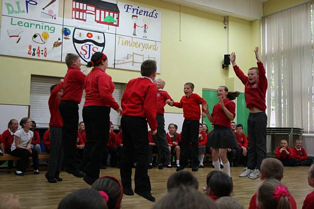 Schoolchildren pracitising folk dance at an English Folk Dance & Song Society workshop