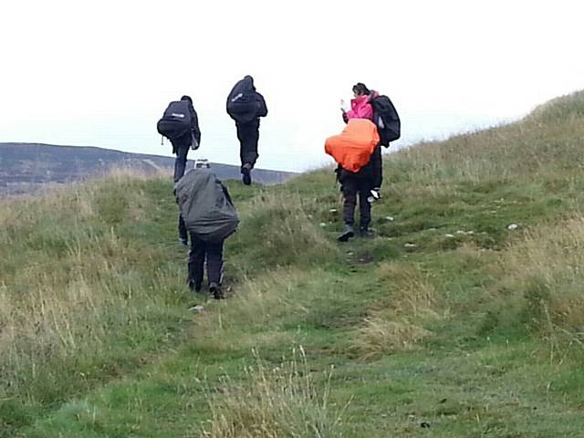 Young people hiking at the camping weekend in the Yorkshire Dales