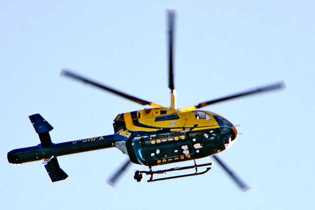 The police helicopter circling above Castleton to help locate a burglary suspect