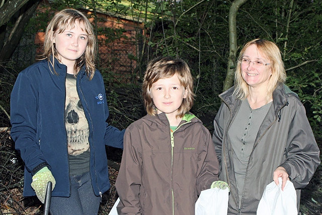 Megan Cross, Owen Cross and Carrline Cross clean up Healey Dell