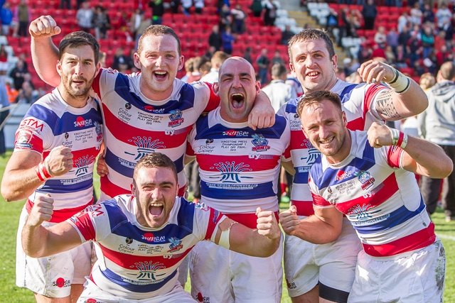 Jubilant Hornets players after winning the play-off final