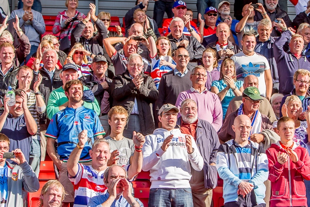 Hornets supporters cheer their Grand Final winning heroes