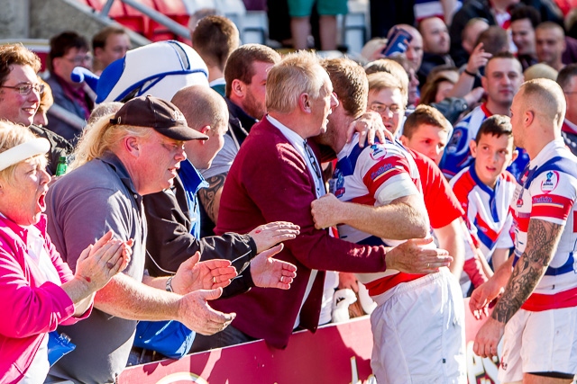 Paul Crook congratulated by the Hornets supporters