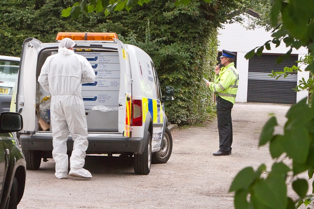 Crime scene investigators at the house on Manchester Road, Hopwood, Heywood