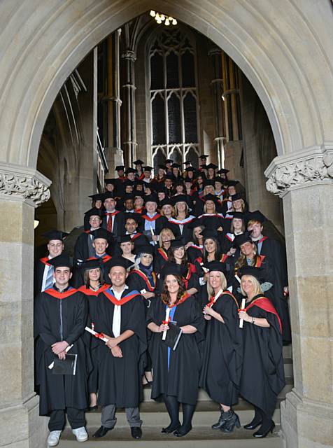 Hopwood Hall College students celebrating their success at the graduation ceremony held at Rochdale Town Hall