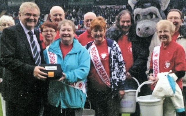 Rochdale Heartbeat presenting an anniversary defibrillator to Rochdale AFC