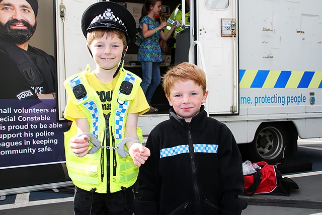 Kian and Euan Lock dress up in police uniforms