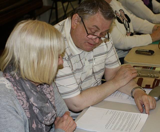 Panel members Marlene Johnson and Frank Altham review an RBH customer letter