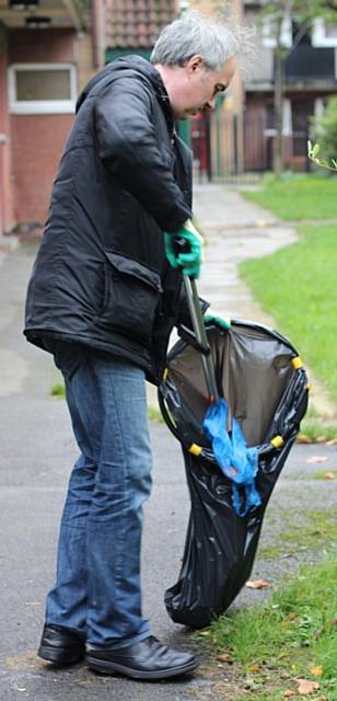 Chief Executive Gareth Swarbrick helps the Heywood Community Cleaning Team