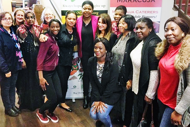 Government Minister, Lynne Featherstone with NESTAC founder Peggy Mulongo, volunteers and FGM survivors