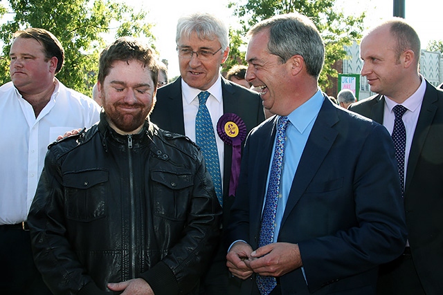 Nigel Farage and UKIP candidate John Bickley chat with a local resident