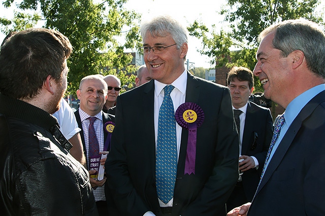 UKIP candidate John Bickley and Nigel Farage chat with a local resident