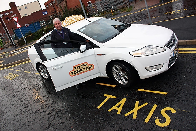 Taxi driver Keith Watson tries out the new rank