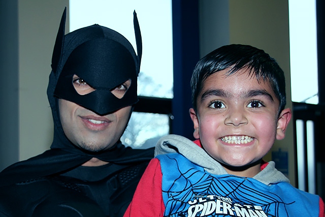 Zayaan Ali with Batman<br />Ghulam Mustafa Trust family fun day