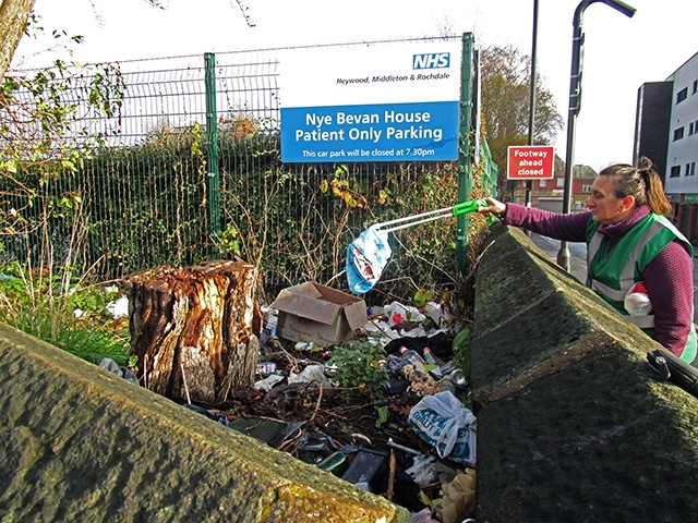 A REAG member cleaning up near NHS Nye Bevan car park