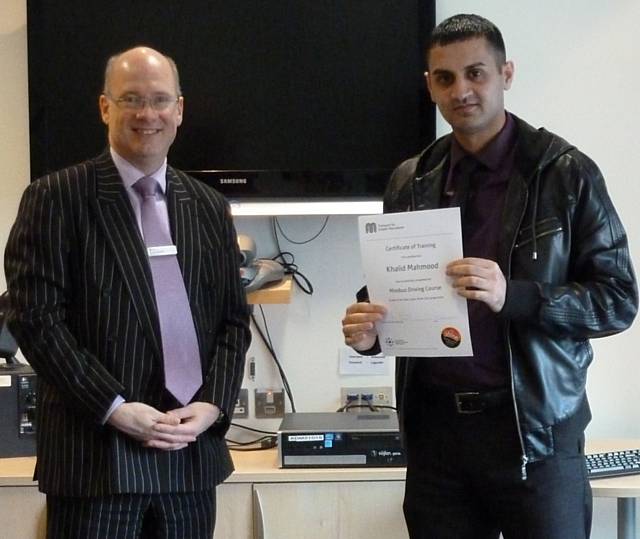 TfGM Chief Executive, Jon Lamonte with Khalid Mahmood