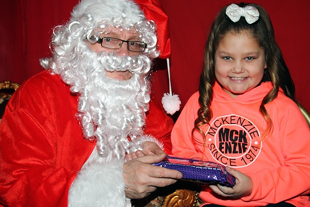 Paris Docherty meets Father Christmas at the Freehold Community Group jingle bell ball