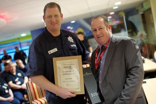 Pete Griffiths receives his award from Pete Dawson of Ballyclare Ltd