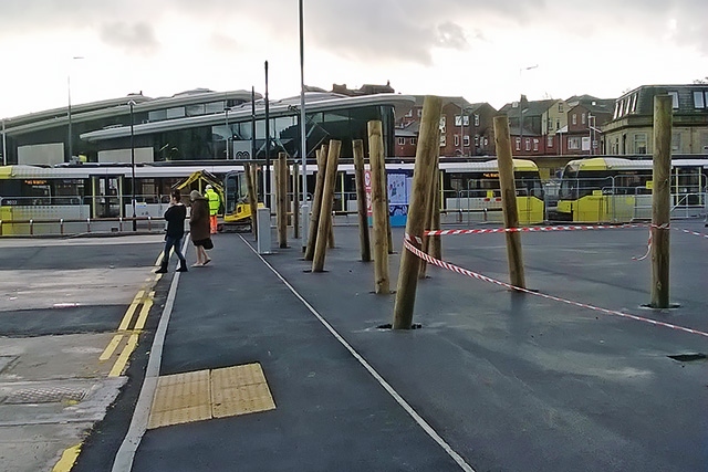 Poles between the market and adjacent car park