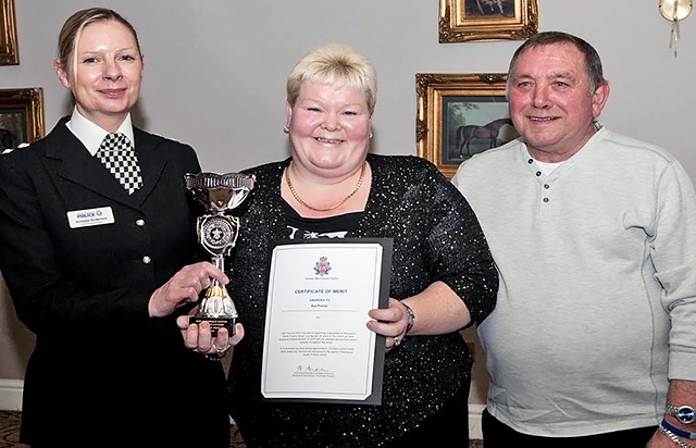 Sue Pickup receiving her a trophy and certificate awarded to her by Chief Superintendent Annette Anderson