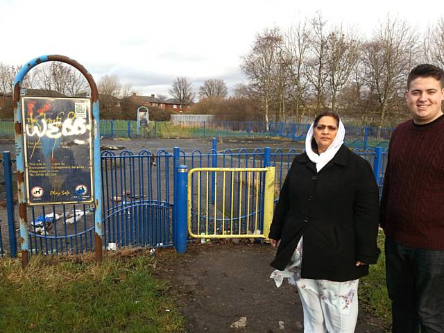 Councillor Amna Mir and local campaigner John Blundell inspect the abandoned children’s play area on the Cray in Firgrove