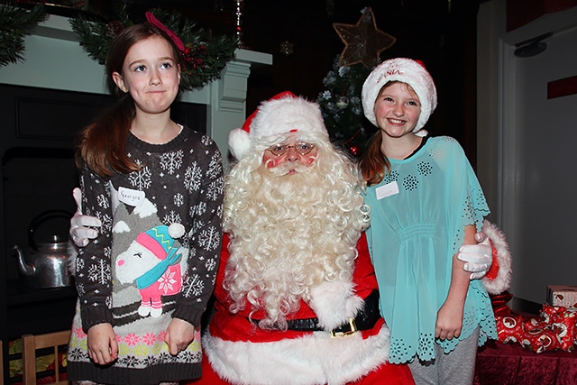 Georgia O'Dea and Caitlin McKune meet Father Christmas