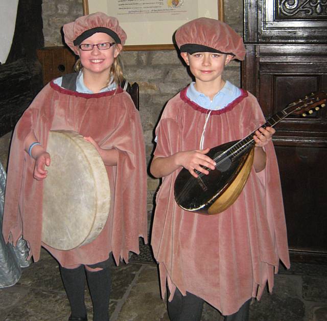 Abbey and Will on a drum and lute