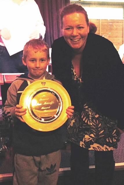 Connor Hoaken is presented with the Ann Metcalfe Memorial plate by her daughter Emma Metcalfe 
